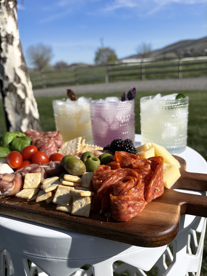 Artfully arranged charcuterie board with seasonal accompaniments